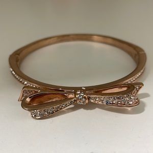 Kate Spade gold bangle with jeweled bow